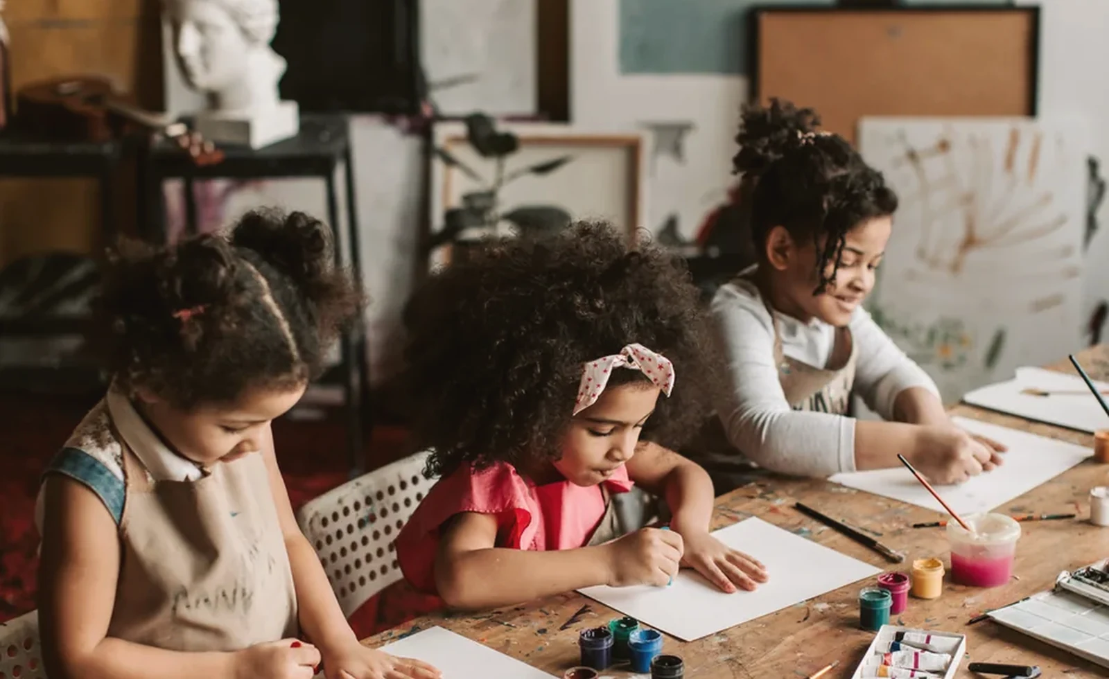 Children participating together in a creative learning activity