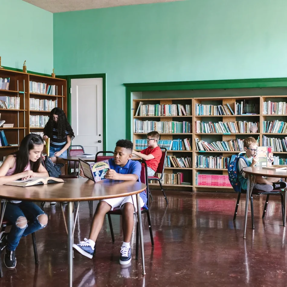 Children reading together in a community setting
