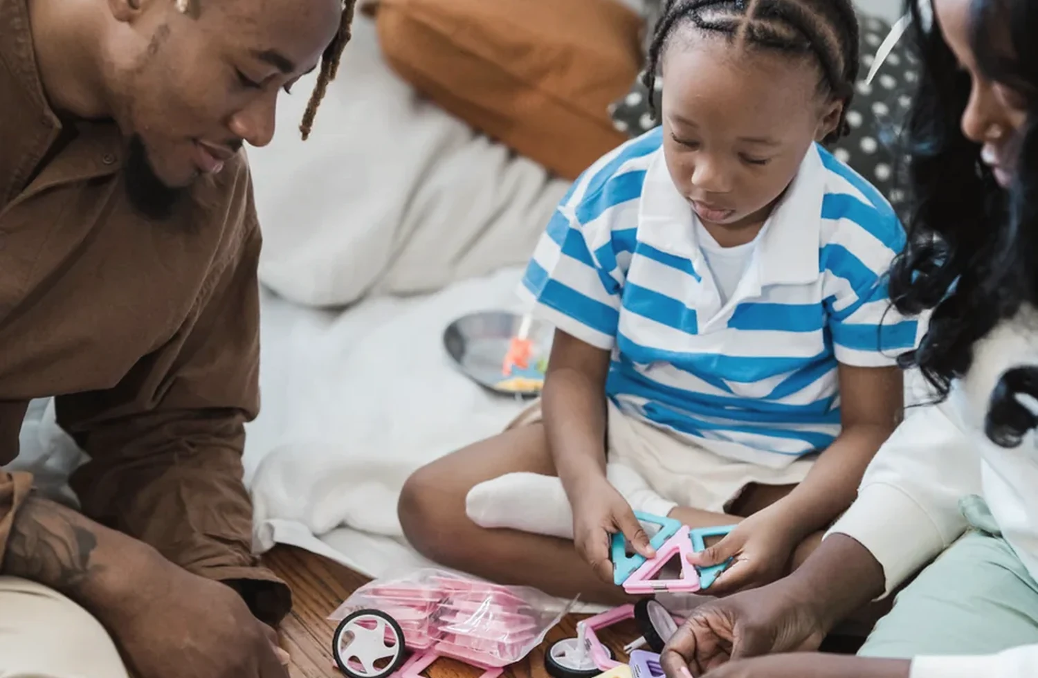 A family participating in a hands-on activity together