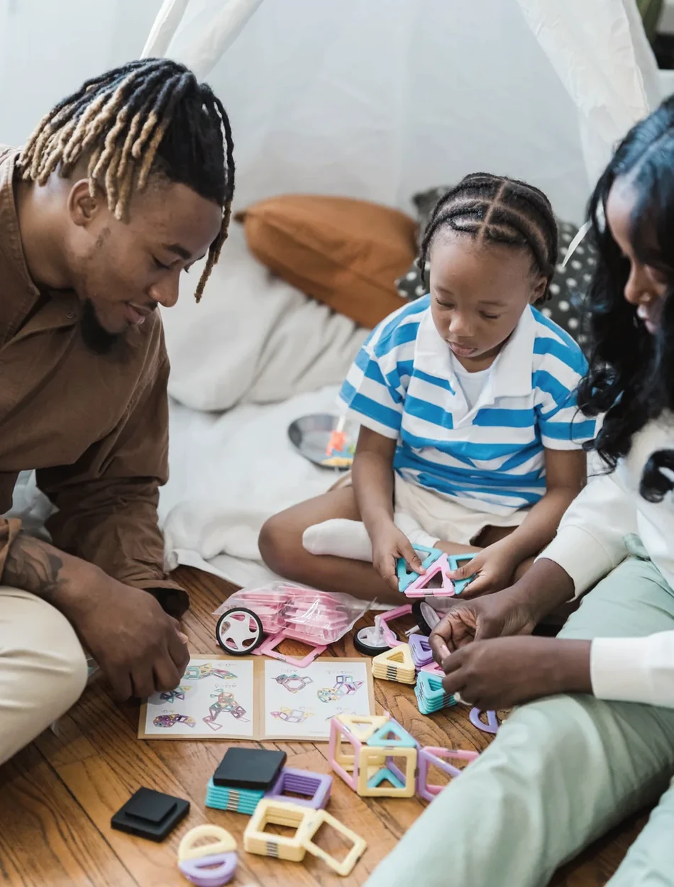 A parent and child sharing a hands-on learning activity